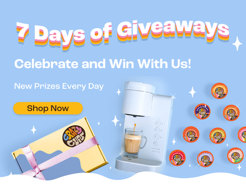 7 days of giveaways banner, with a photo of a white keurig machine, crazy cup pods, and a gift box against a blue background, with the subtitles "celebrate and win with us!" and "new prizes every day," as well as a yellow "shop now" button.